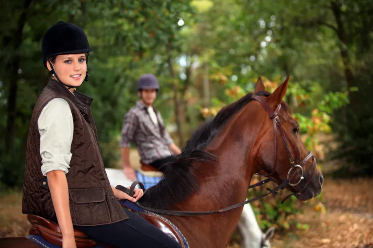 Horseback riding near Reno Tahoe on a trail with mountain and pine scenery