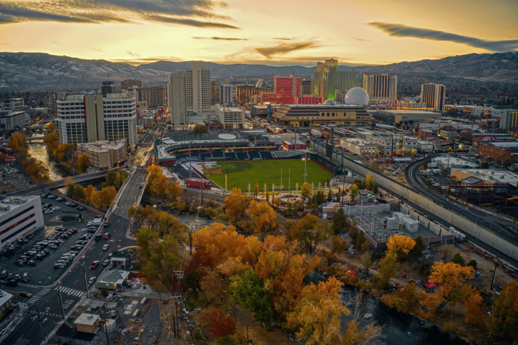 Reno Aces baseball game at Greater Nevada Field in downtown Reno Nevada with fans in the stands and mountain views