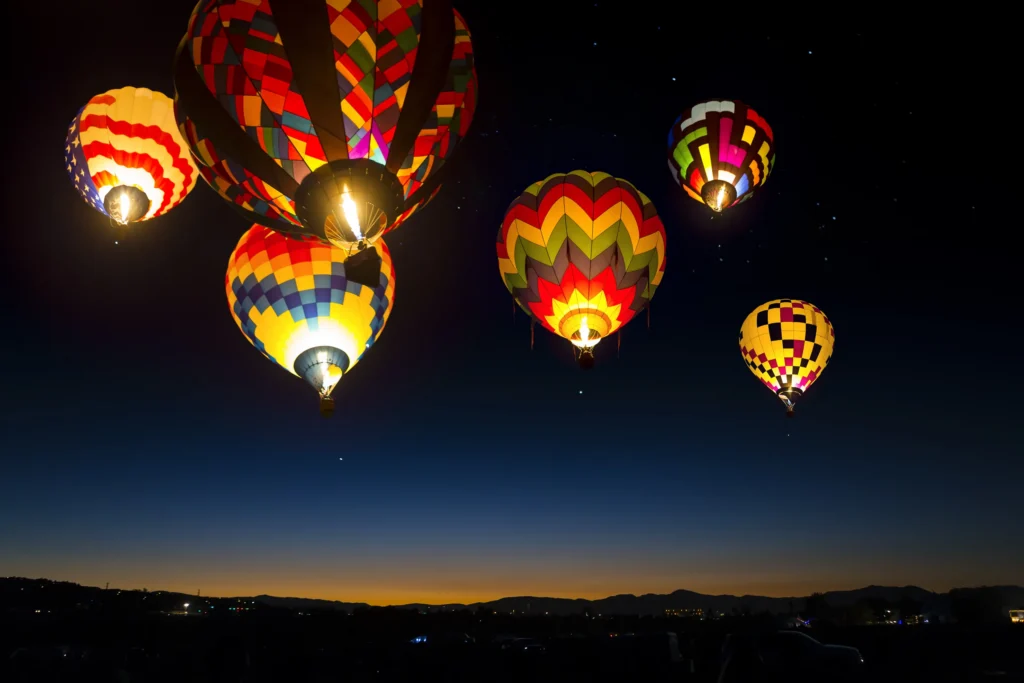 Hot air balloons launching at the Reno Balloon Races in Reno Nevada during early morning dawn patrol at Rancho San Rafael Regional Park