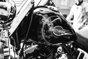 Motorcycles lined through downtown Reno Nevada during Street Vibrations motorcycle rally with riders, crowds, and city backdrop